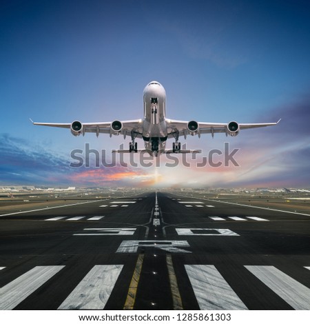 Airplane taking off from the airport, front view.
