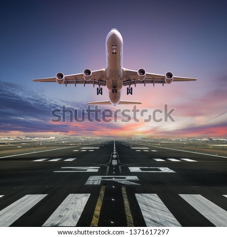 Airplane taking off from the airport, front view.