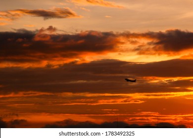 Airplane Taking Off In Bogota Sunset