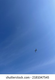 Airplane Taking Off On The Bright Blue Sky No Clouds, Reminds About Dreams Come True And Achievements Of Goals