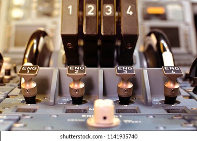 Airplane Throttle Levers Photo.Four Jet Engine Airplane Throttle Levers And Instrument In The Cockpit. Fuel On Off Knob Switch Of Aircraft.  Aircraft Maintenance In Cockpit.