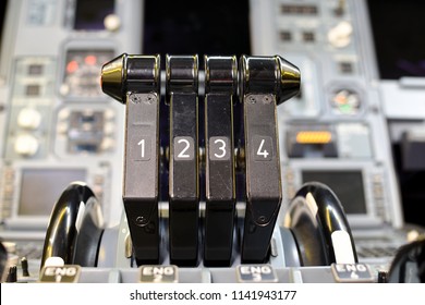 Airplane Throttle Levers Photo.Four Jet Engine Airplane Throttle Levers And Instrument In The Cockpit. Fuel On Off Knob Switch Of Aircraft.Aircraft Maintenance In Cockpit. 