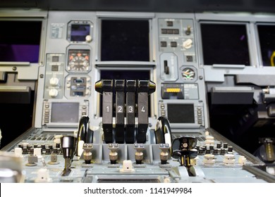 Airplane Throttle Levers Photo.Four Jet Engine Airplane Throttle Levers And Instrument In The Cockpit. Fuel On Off Knob Switch Of Aircraft. 