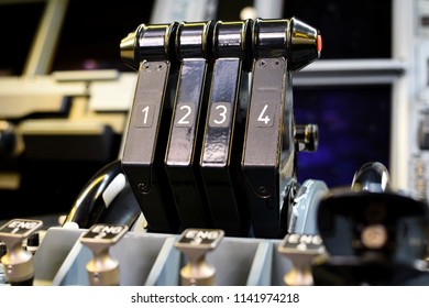 Airplane Throttle Levers Photo.Four Jet Engine Airplane Throttle Levers And Instrument In The Cockpit. Fuel On Off Knob Switch Of Aircraft. 