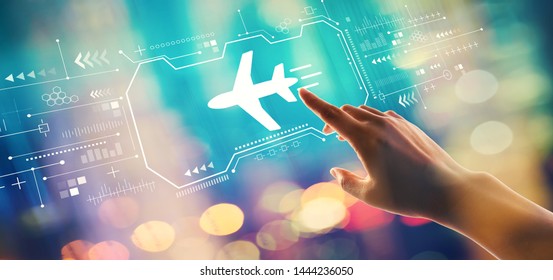 Airplane Travel Theme With Hand Pressing A Button On A Technology Screen