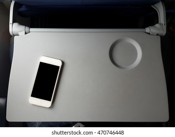 Airplane Tray Table On Seat Back With Smartphone