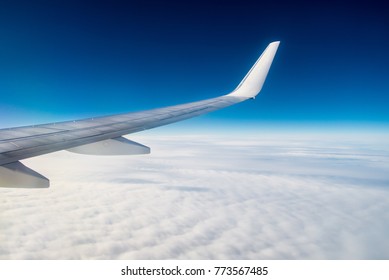 Airplane under the clouds