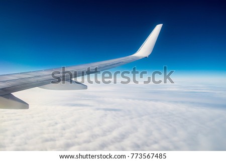 Airplane under the clouds