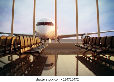 Airplane, view from airport terminal. - Shutterstock ID 124713472