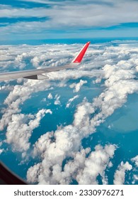 the airplane and white clouds