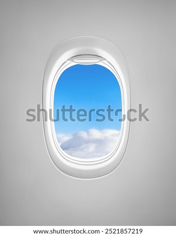 Airplane window with blue sky and clouds view
