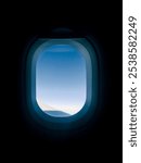 Airplane window isolated on darkness. Airplane peace of wing view. The blue, clear sky with the wings of the airplane that can see outside the window.