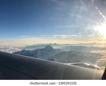airplane window mountain range