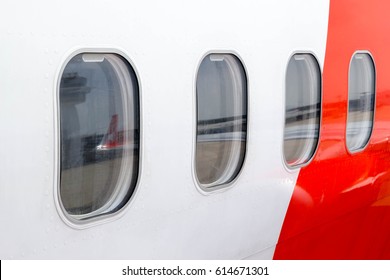 Airplane Window From The Outside At The Airport