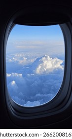 Airplane Window View of Clouds and Sky – Aerial Travel Photography from Plane