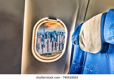 Airplane Window With View On New York City. Holiday And Travel Concept.