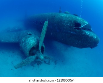 airplane wreck underwater with propeller airplane engine 