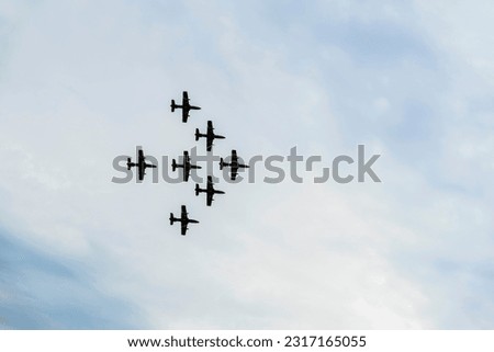 Airplanes on airshow, jets flying. Aircrafts in flying. Exciting performance. Air performance, aircrafts, flying display and skill teamwork. Abstract background