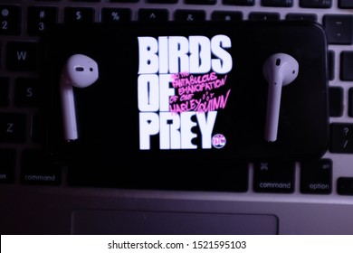 AirPods 2, Computer Keyboard And Iphone 11 Pro With The Logo Of The Birds Of Prey Movie That Is An Upcoming American Superhero Movie. United States, New York, Thursday, October 3, 2019.