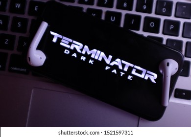 AirPods 2, Computer Keyboard And Iphone 11 Pro With The Logo The Dark Fate Terminator Movie That Is A New Movie About To Be Released. United States, New York, Thursday, October 3, 2019.