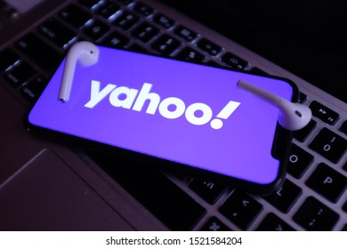 Airpods 2 and Iphone 11 pro with the new Yahoo logo that is a global digital media company. United States, New York, Thursday, October 3, 2019.