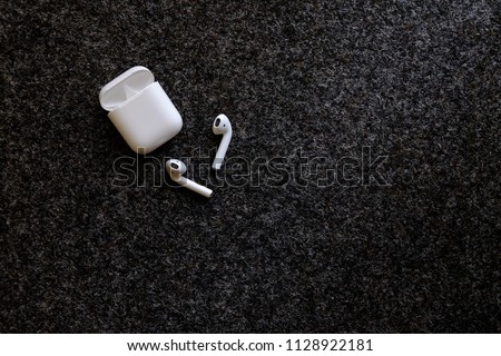 AirPods on the black background