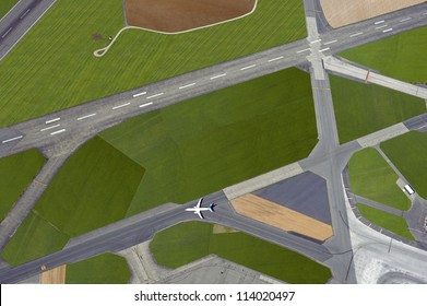Airport - aerial view with runways, taxis, grass and air-crafts