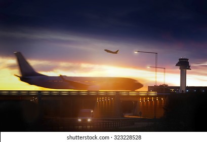 Airport airliner at dusk departure with control tower