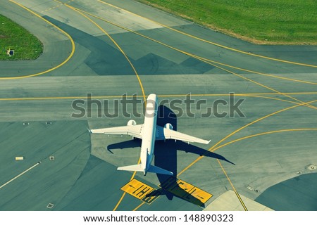 Airport - Airplane is taxiing for take off.