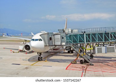 Airport Apron With Passenger Plane And Jet Bridge For Passengers