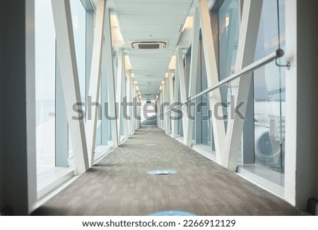 Airport backgrounds, terminal hallway and corridor for traveling, journey and covid transport regulations. Empty walkway for airplane flight, immigration and interior design tunnel space for walking