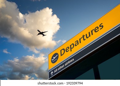 Airport Departure & Arrival information sign with sky - Shutterstock ID 192339794