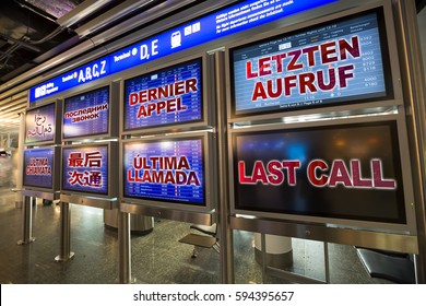 In Airport Departure Board Displays The Last Call In English, German, French, Arabic, Russian, Chinese, Spanish, Italian