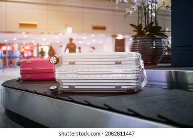 Airport Luggage Trolley With Suitcase Or Luggage Baggage On Conveyor Belt In Airport, Transport Business At Departure Lounge Traveler In Terminal Background, Traveling Baggage In Summer Holiday