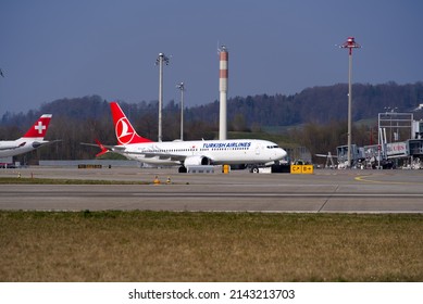 Zürich Airport with parked Turkish Airline airplane Boeing 737 MAX 8 register TC-LCP on a blue cloudy spring day. Phot taken March 26th, 2022, Zurich, Switzerland.