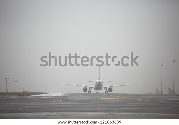 Airport runway in bad\
weather, Prague