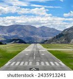 Airport runway with panoramic mountain view