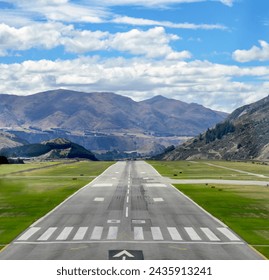 Airport runway with panoramic mountain view - Powered by Shutterstock