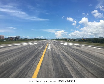 Airport Runway Range From Pilot View In Aircraft Cockpit Line Up For Take Off With Sea And Blue Sky Background And Copy Space