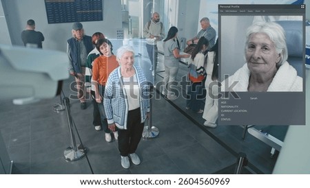 Airport Security Checkpoint: Queue of Diverse People Passing Biometric Facial Recognition at Passport Border Control for Boarding Flight. Rack Focus on CCTV Camera with Advanced AI Scanning Technology