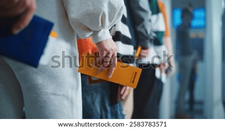 Airport Security Checkpoint: Queue of Passengers, Travelers Standing for Metal Detector Scanning Gates with Tickets and Documents in Hands. Diverse People Undergoing TSA Screening Procedures. Close Up