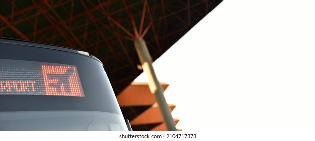 Airport Shuttle Bus With Led Destination Sign Is Parked Under Station Canopy On White Sky Background