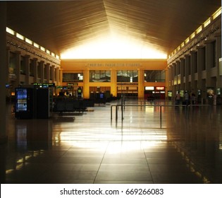 Málaga Airport, Spain - 27th May 2012: Almost Empty Interior Of Málaga Airport At Sunday With Golden Light Through Roof Window