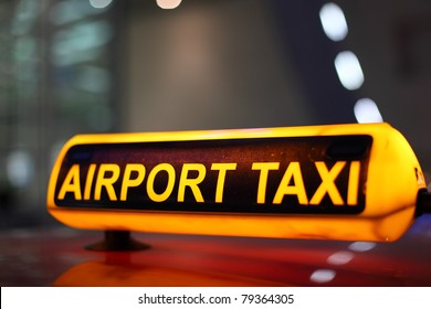 Airport Taxi sign illuminated at night