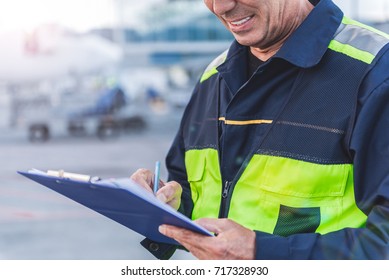 Airport Technical Staff Hand Making Notes