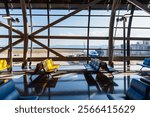 Airport terminal glass window with view of airplane, airport interior departure hall for travel and transportation concept.