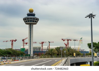 airport tower and road way to terminal in day time