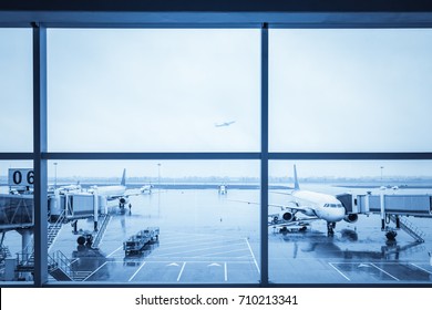 Airport Window View With Blue Tone On A Rainy Day