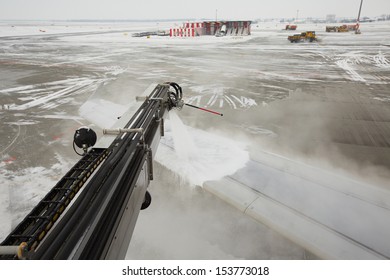 Airport in winter - Deicing of the airplane