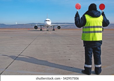 Airport Worker Directing